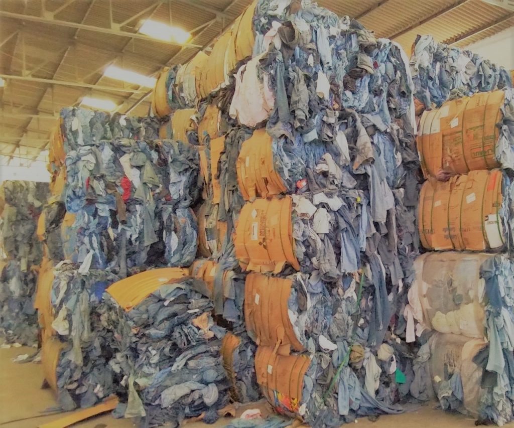 bales of denim at bank and vogue