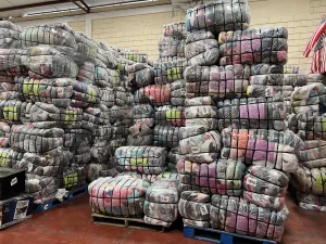 Used clothing on palates piled high