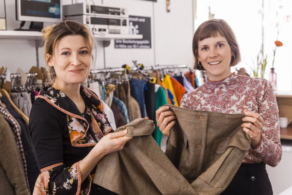 Portrait of two women in a second hand shop